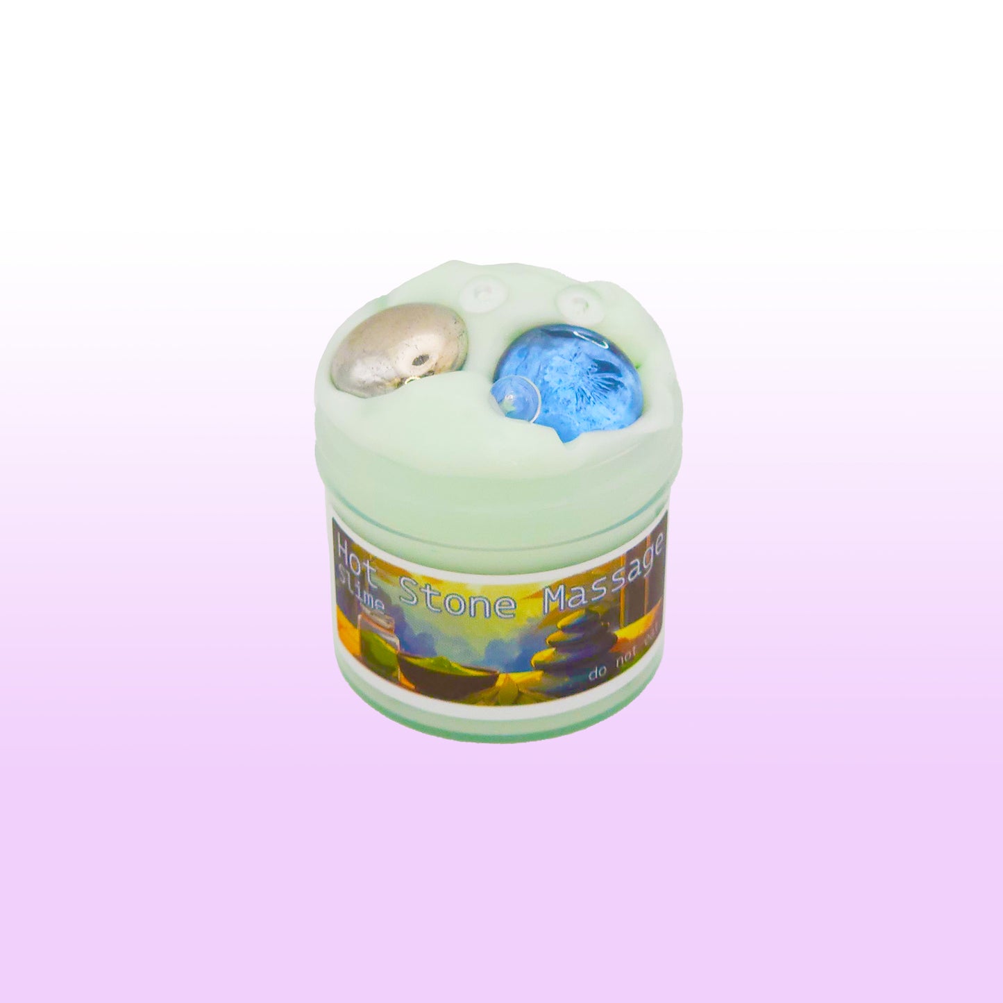 Crunchy fishbowl slime with teal tint and stone beads inspired by hot stone massage