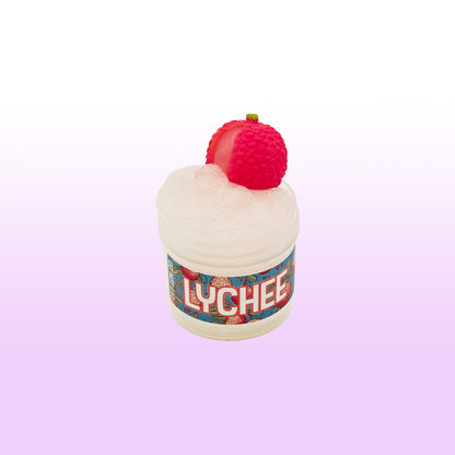Lychee slime with lychee charm on top against a light pink background