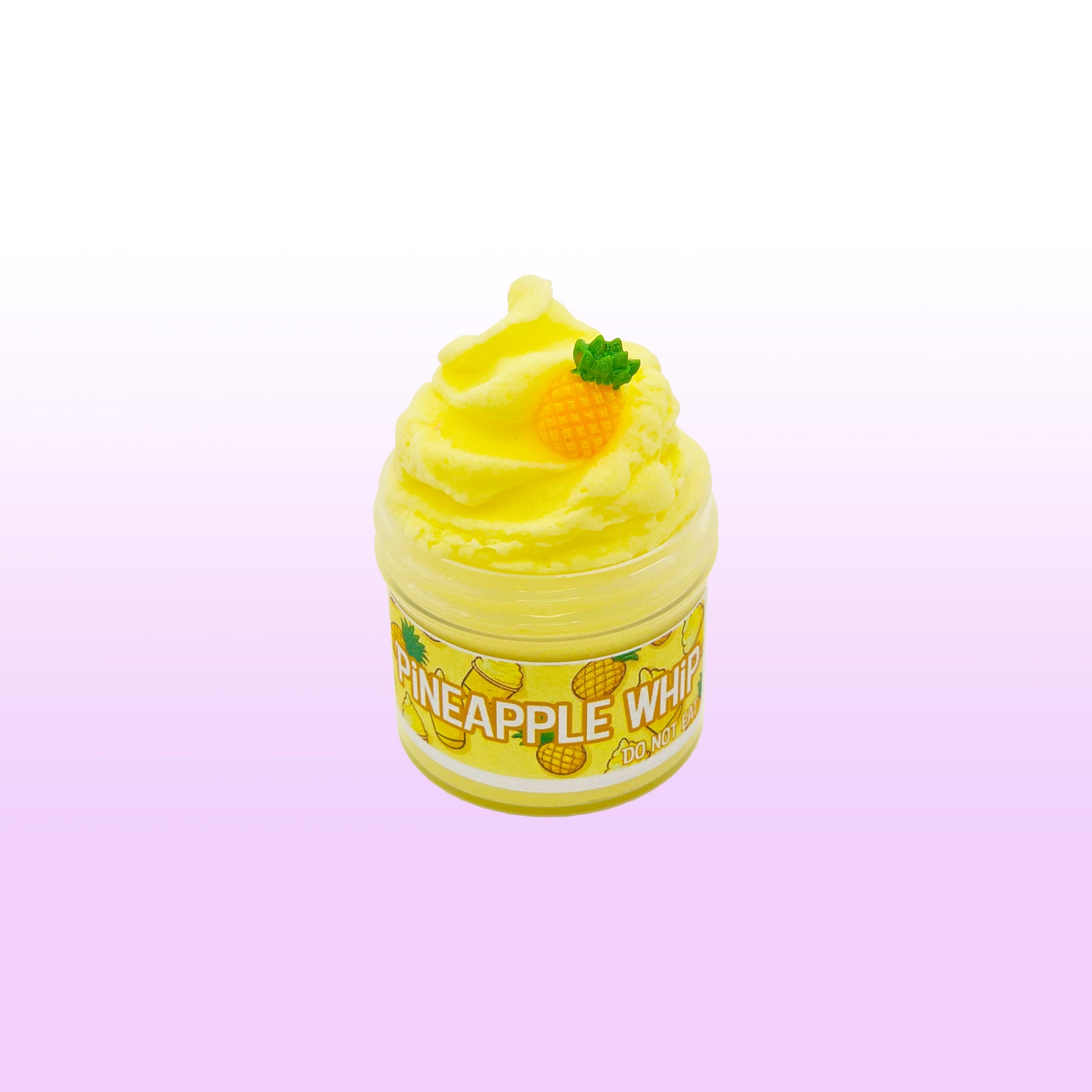 Yellow pineapple-themed product on a light purple background