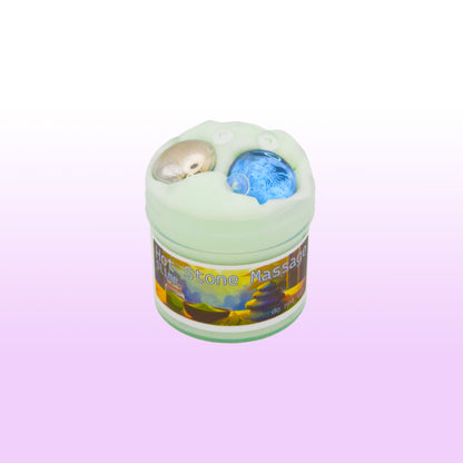 Crunchy fishbowl slime with teal tint and stone beads inspired by hot stone massage