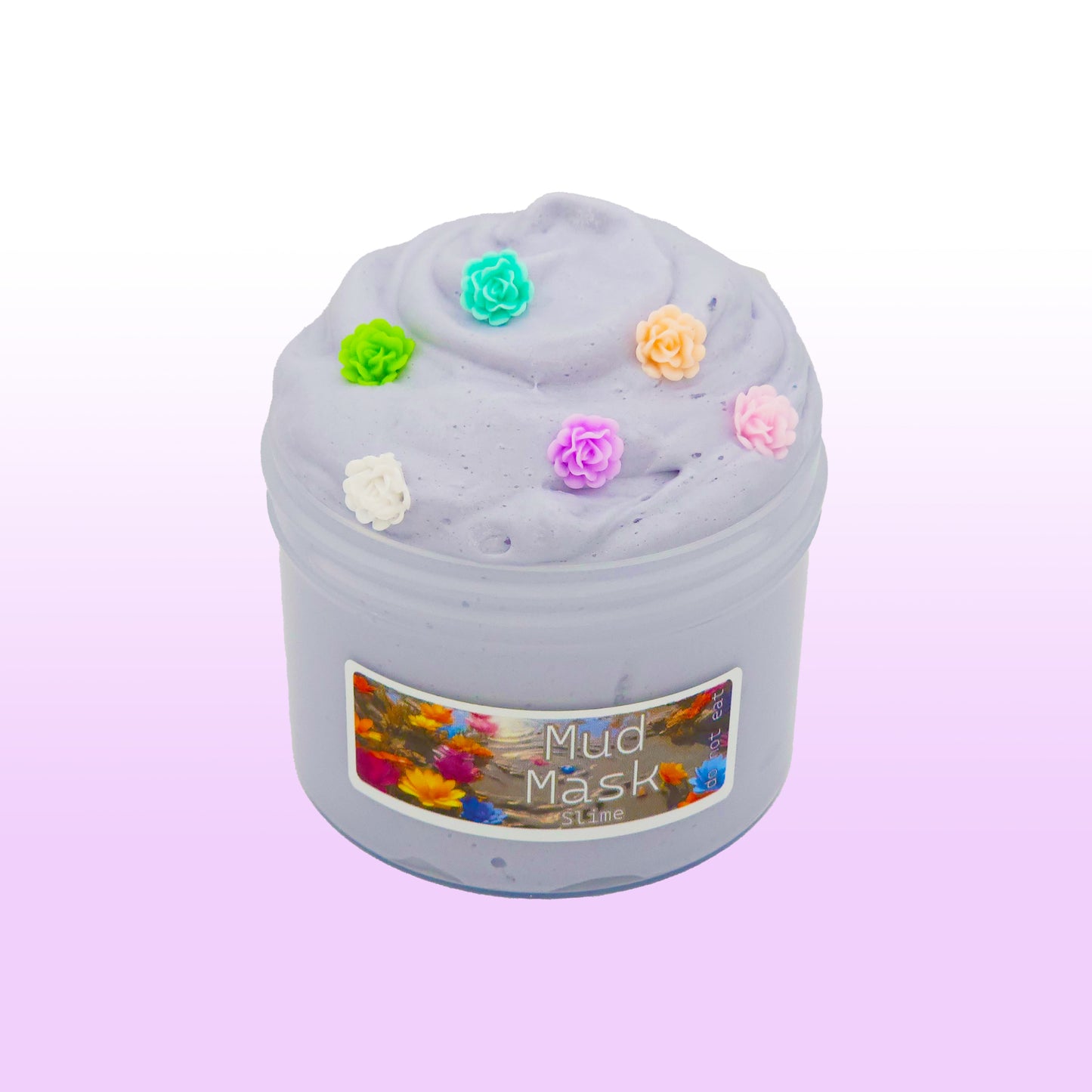 Gray butter slime scented with white tea and sage, topped with lotus flower charms