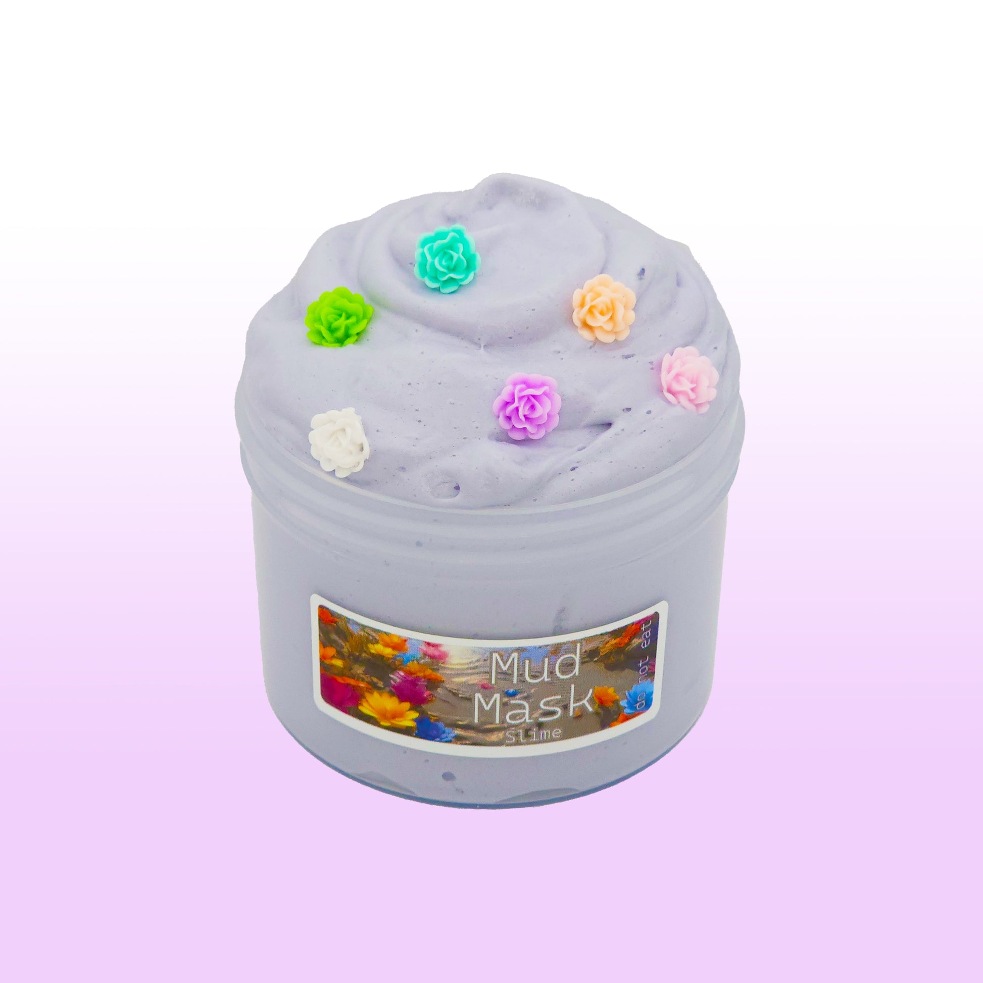 Gray butter slime scented with white tea and sage, topped with lotus flower charms