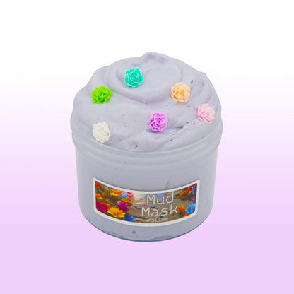 Gray butter slime scented with white tea and sage, topped with lotus flower charms